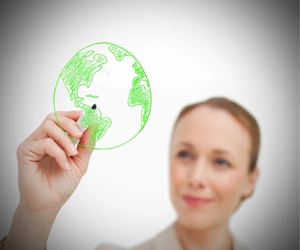 Woman drawing globe with marker — Stock Photo, Image