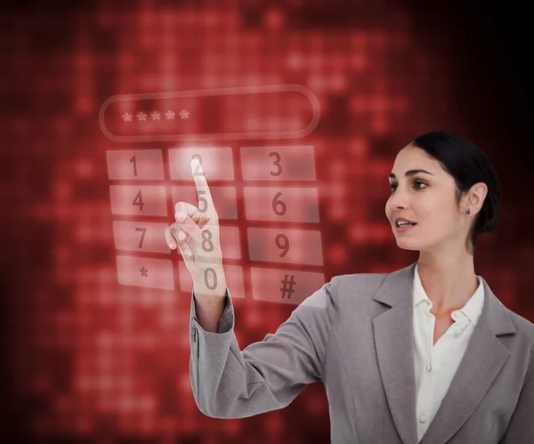 Businesswoman standing against a red background — Stock Photo, Image