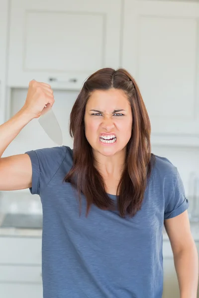 Angry woman holding knife — Stock Photo, Image