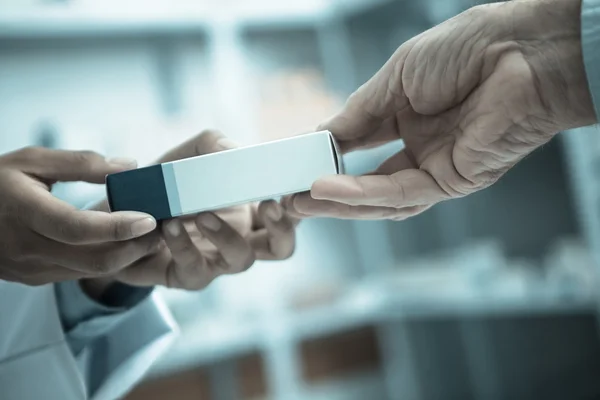 Medicine pack being handed to someone — Stock Photo, Image