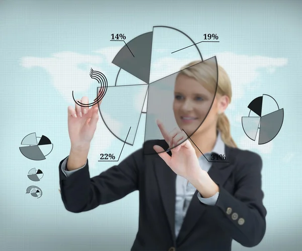 Businesswoman touching screen with graphs — Stock Photo, Image