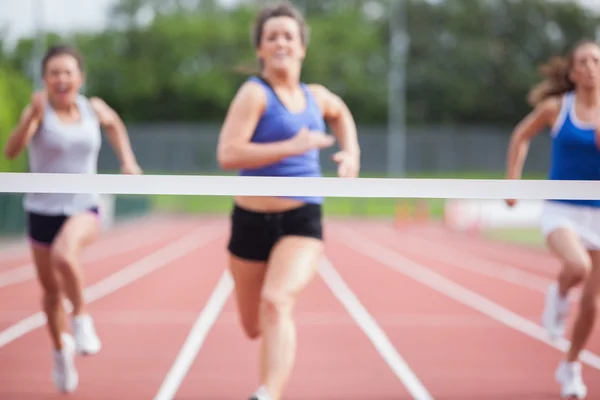 Athletes close to finish line — Stock Photo, Image