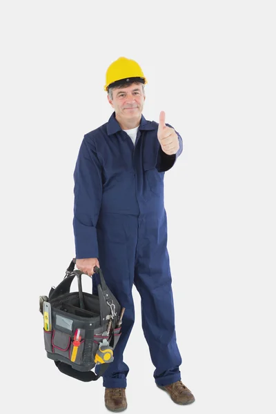 Mechanic with tool bag showing thumbs up sign — Stock Photo, Image