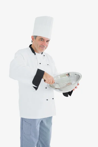 Mature chef using whisk and mixing bowl — Stock Photo, Image