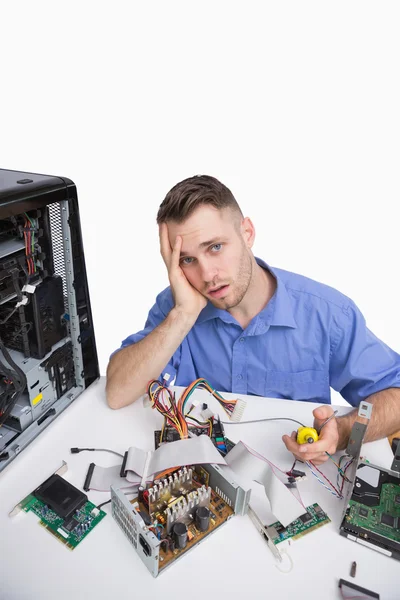 Portrait of tired computer engineer with cpu parts — Stock Photo, Image
