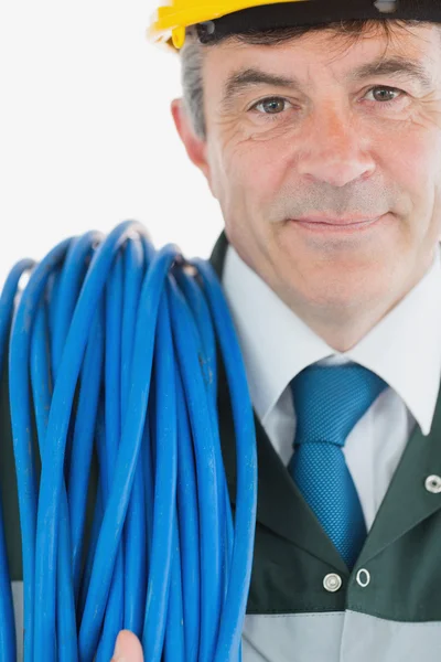 Repairman with rolled cable — Stock Photo, Image