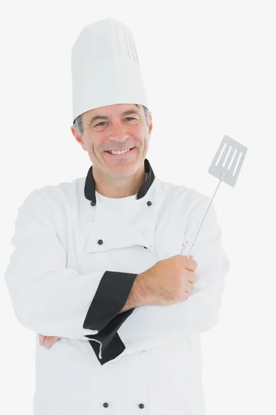 Homem de uniforme chef segurando espátula — Fotografia de Stock