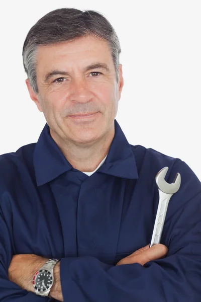 Confident machanic holding wrench — Stock Photo, Image