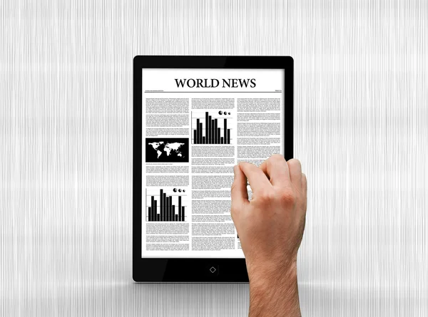 Hand scrolling through world news on digital tablet — Stock Photo, Image