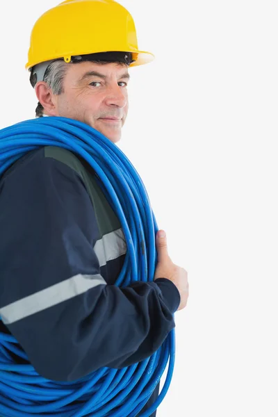 Repairman wearing hardhat with cable — Stock Photo, Image
