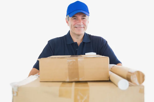 Happy mature courier man carrying cardboard boxes — Stock Photo, Image