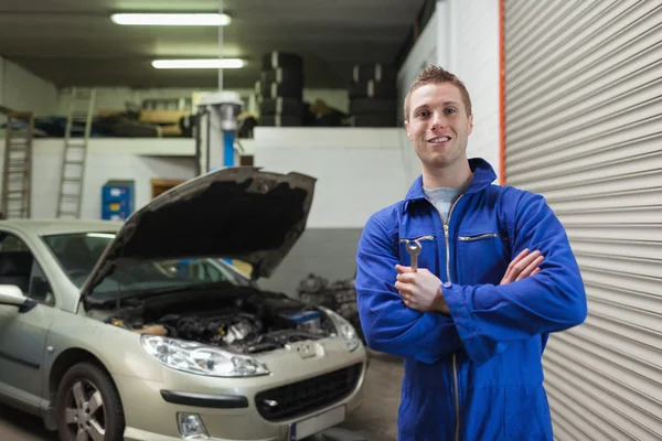 Confident male mechanic with spanner — Stock Photo, Image