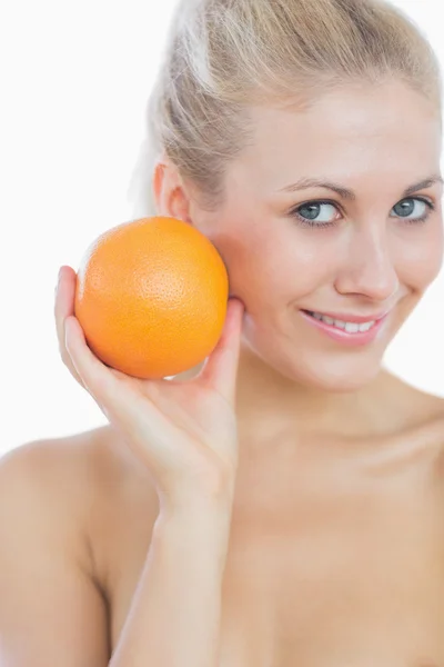 Happy woman holding fresh orange — Stock Photo, Image