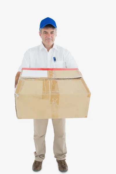 Mature courier man carrying package — Stok fotoğraf