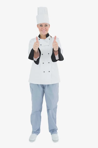Жіночий шеф-кухар жестикулює великі пальці вгору знак — стокове фото
