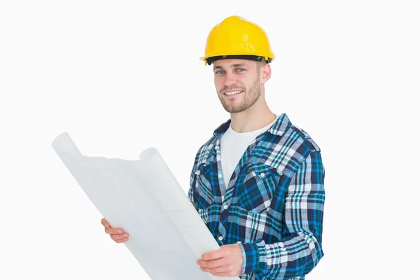 Portrait of smiling young male architect with blueprint — Stock Photo, Image