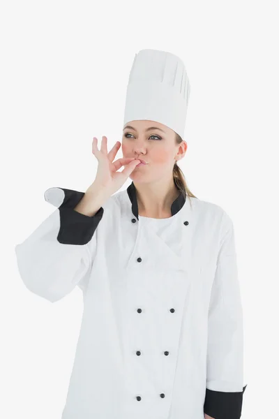 Női szakács ujjait csók — Stock Fotó