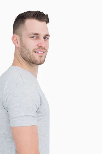 Side view portrait of smiling young man — Stock Photo, Image