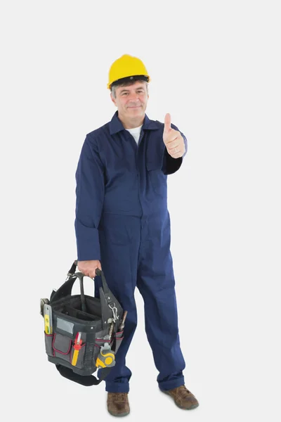 Mechanic with tool bag showing thumbs up sign — Stock Photo, Image