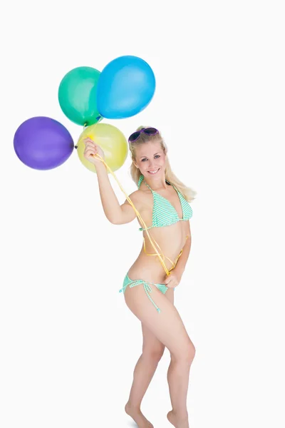 Happy woman holding balloons — Stok fotoğraf