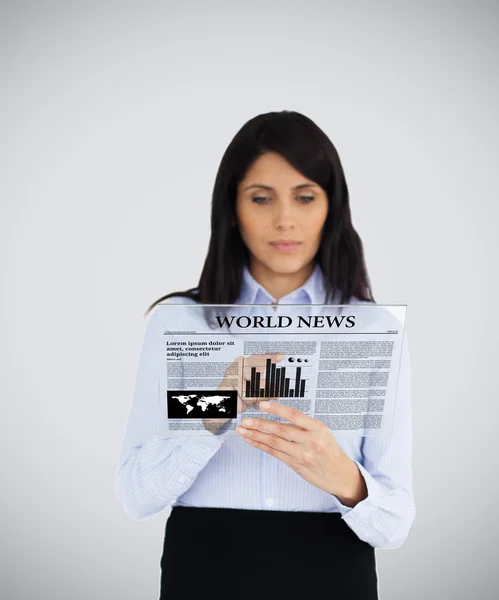 Businesswoman reading virtual newspaper — Stock Photo, Image