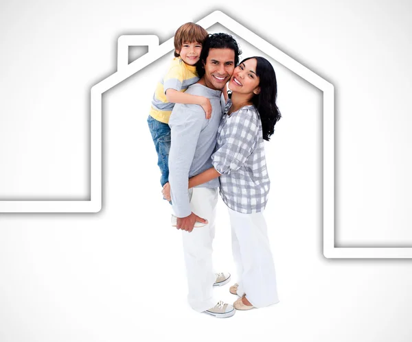 Happy family standing with a white house illustration on a white — Stock Photo, Image