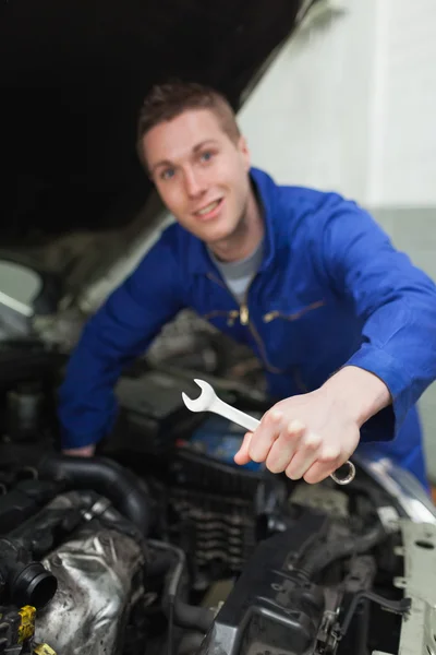 Mechanic with spanner repairing car Stock Picture