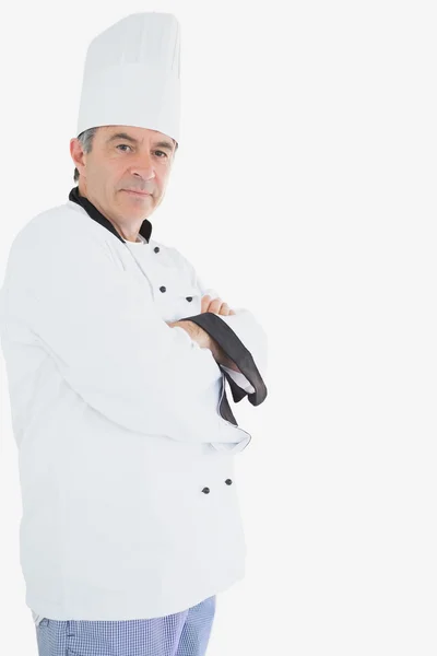 Mature chef in uniform standing with arms crossed Royalty Free Stock Photos