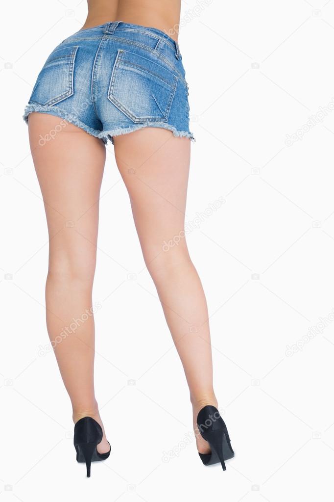 Beautiful legs of woman in shorts and high heels Stock Photo by  ©Wavebreakmedia 24091583