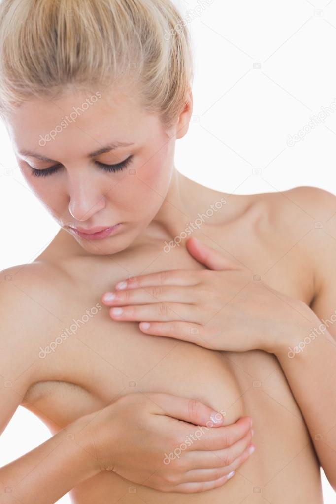 Side View Of Beautiful Nude Woman Examining Her Breast. Stock