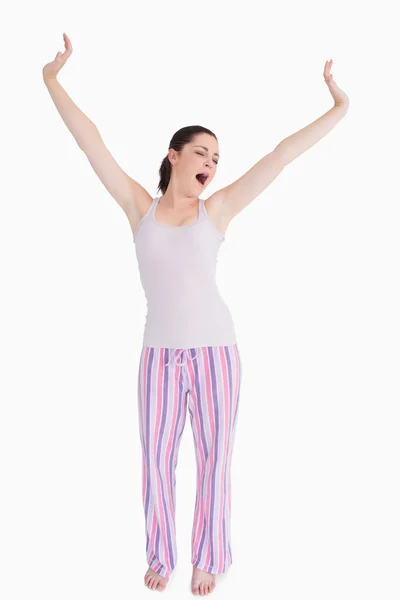 Standing woman stretching and yawning — Stok fotoğraf