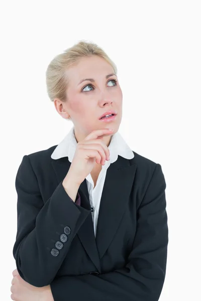 Thoughtful young business woman looking up — Stock Photo, Image