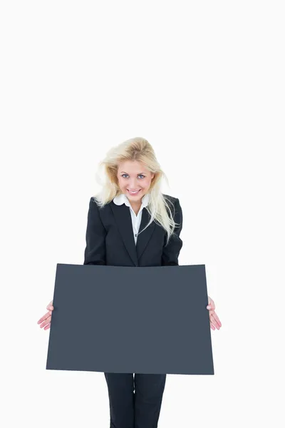 Portrait of business woman holding empty banner — Stock Photo, Image