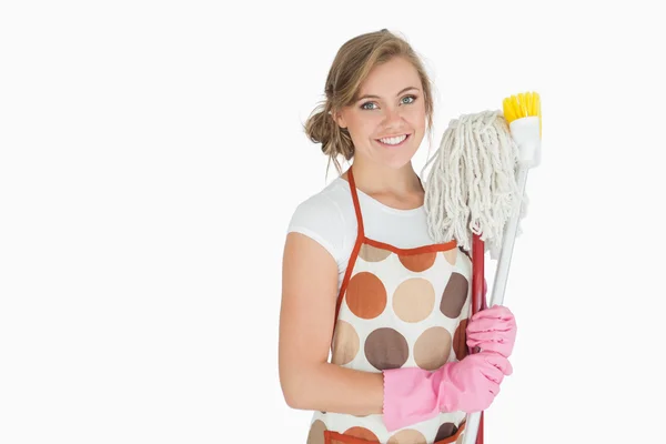 Portrait of smiling woman with cleaning supplies — Stock Photo, Image