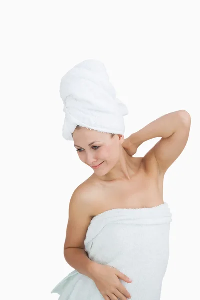 Happy young woman wrapped in towel — Stock Photo, Image