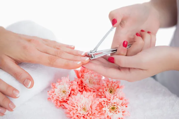 Woman cutting fingernail — Stock Photo, Image
