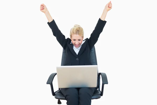 Successful business woman raising hands in victory with laptop — Stock Photo, Image