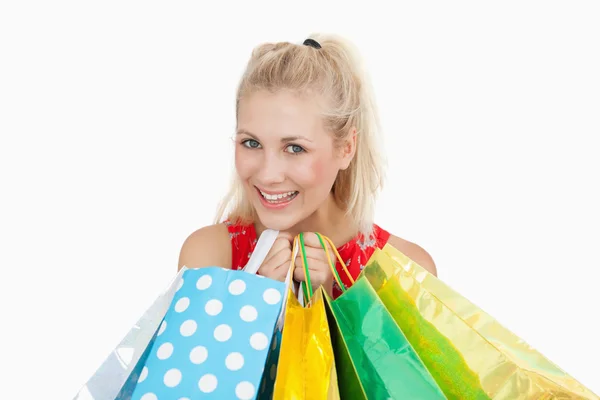 Portrait of cute young woman with shopping bags — Stock Photo, Image