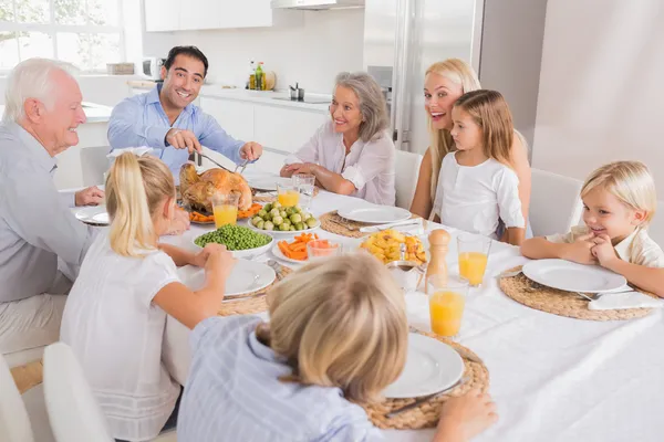 Father proposing a slice of turkey — Stock Photo, Image