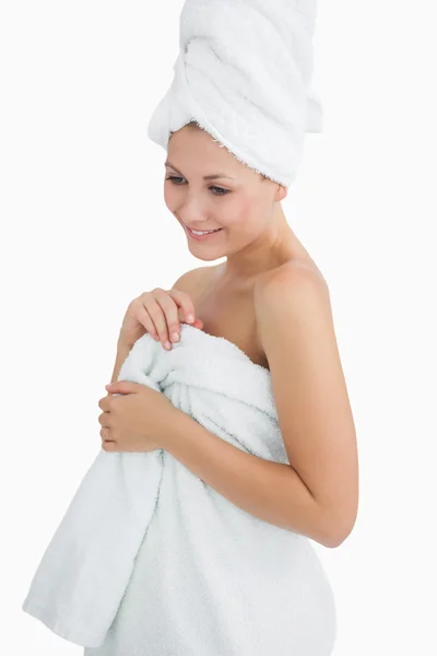 Happy young woman wrapped in towel — Stock Photo, Image