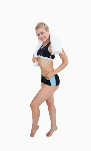 Portrait of happy young woman in sportswear giving thumbs up — Stock Photo, Image