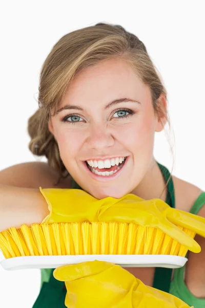 Close-up portrait of cheerful woman with broom — Stock Photo, Image