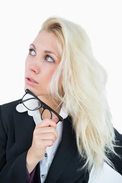 Thoughtful young business woman looking up — Stock Photo, Image