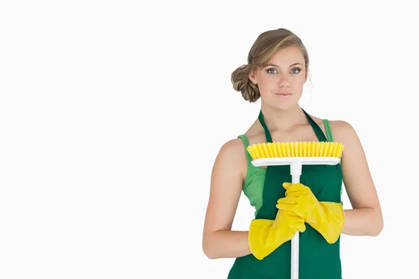 Portrait of young woman with broom — Stock Photo, Image