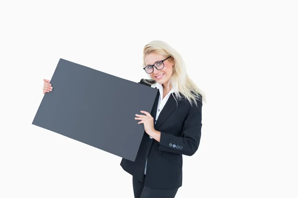 Portrait of happy young business woman holding blank board — Stock Photo, Image