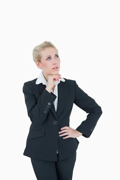 Thoughtful young business woman looking up — Stock Photo, Image