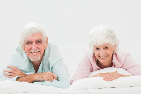 Happy couple in bed — Stock Photo, Image