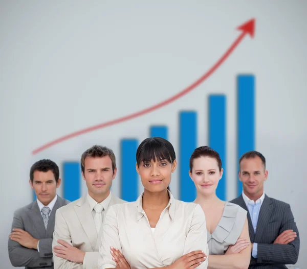 Business team smiling with a graph illustration — Stock Photo, Image