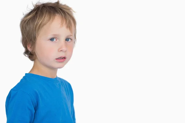 Portrait of cute young boy standing Stock Picture