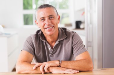 Happy man in kitchen clipart